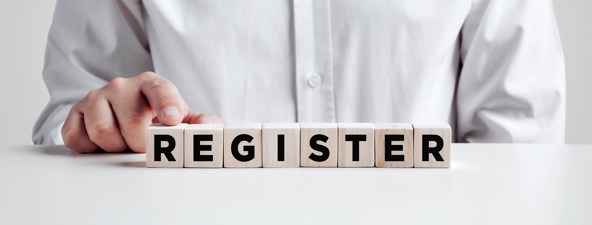 A picture of dice spelling the word register