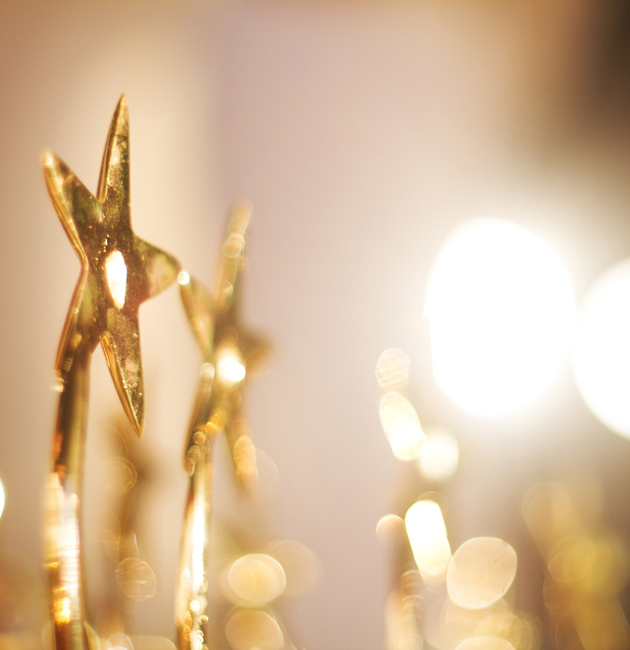 A picture of gold award trophies
